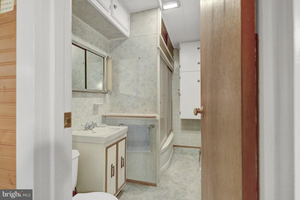 3475 Valley Road Marysville, PA 17053 - Photo 9 of 25 a bathroom with a sink and mirror with toilet