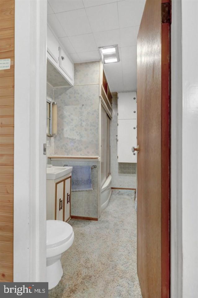 3475 Valley Road Marysville, PA 17053 - Photo 10 of 25 a bathroom with a granite countertop toilet a sink and a mirror