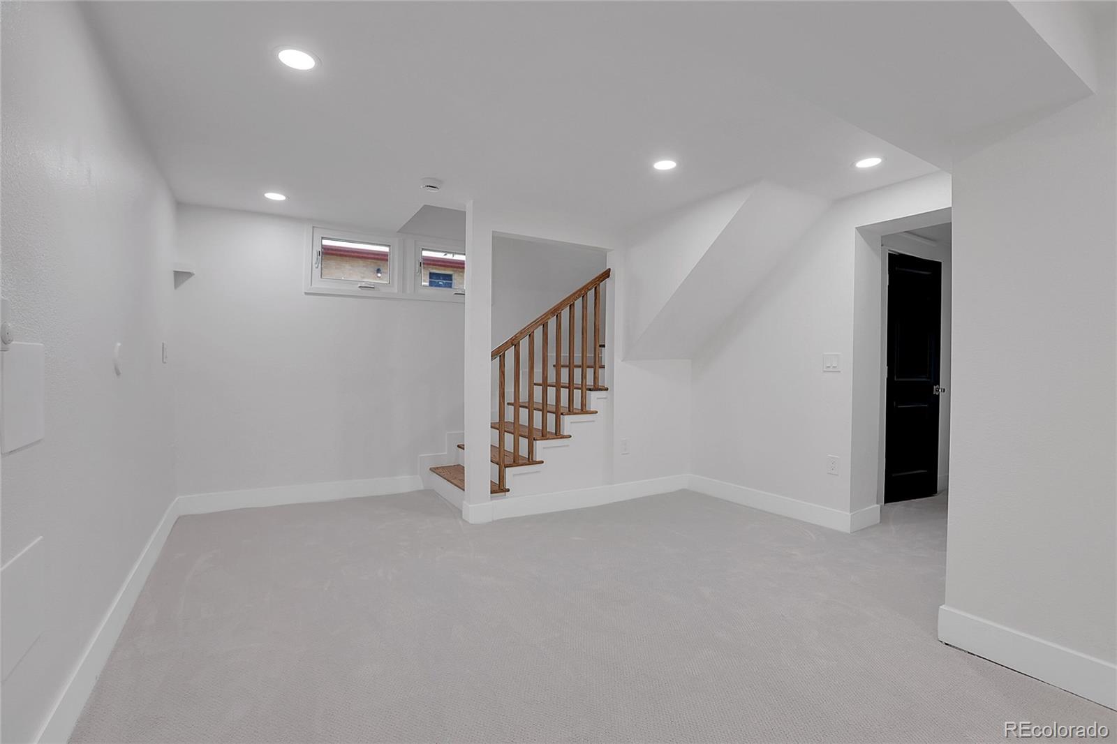1260 Garfield Street Denver, CO 80206 - Photo 17 of 24 a view of an empty room with stairs