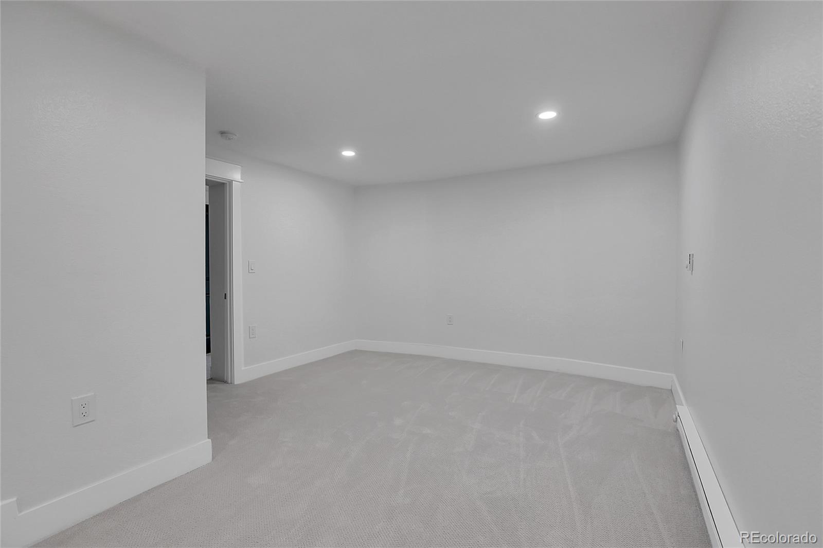 1260 Garfield Street Denver, CO 80206 - Photo 20 of 24 an empty room with a empty space and window