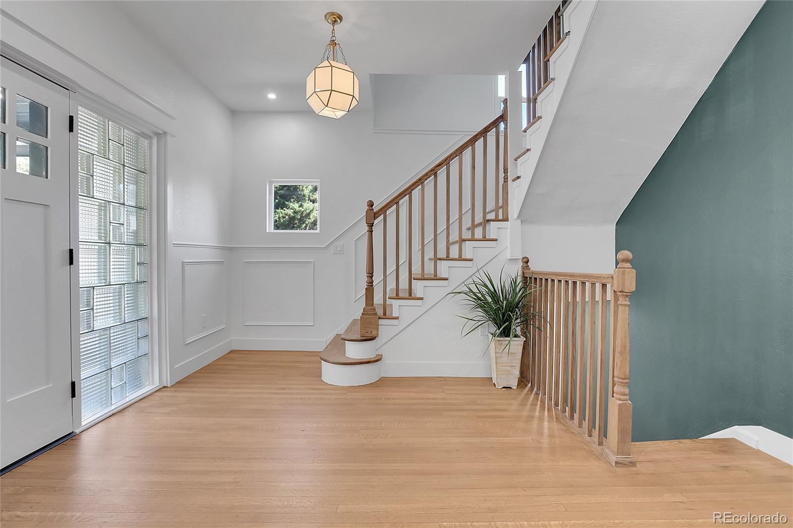 1260 Garfield Street Denver, CO 80206 - Photo 3 of 24 a view of entryway and hall with wooden floor