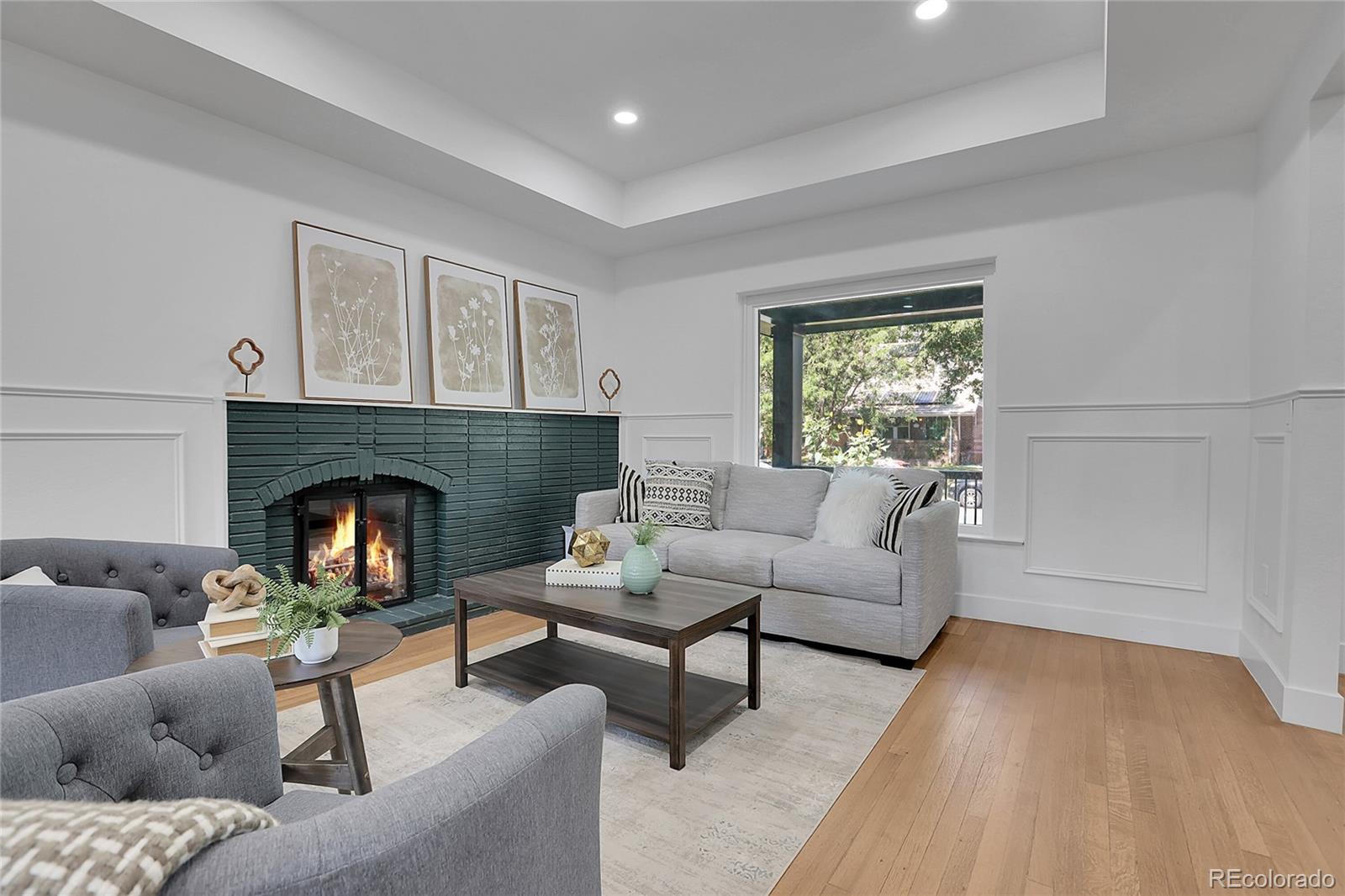 1260 Garfield Street Denver, CO 80206 - Photo 4 of 24 a living room with furniture and a fireplace