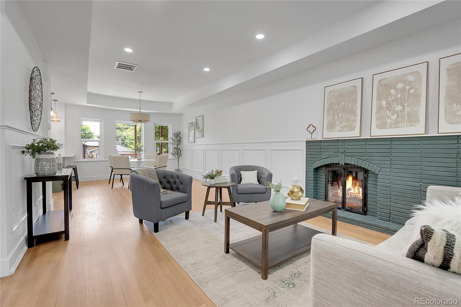 1260 Garfield Street Denver, CO 80206 - Photo 5 of 24 a living room with furniture and a fireplace