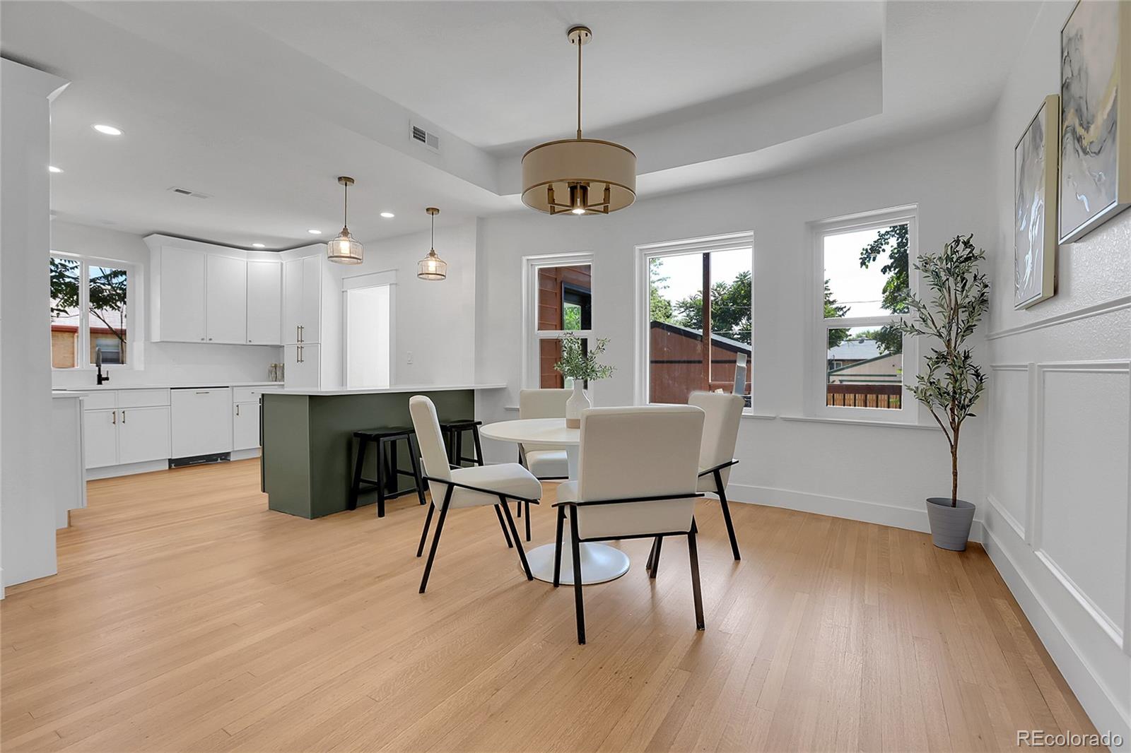 1260 Garfield Street Denver, CO 80206 - Photo 6 of 24 a view of a dining room with furniture window and wooden floor