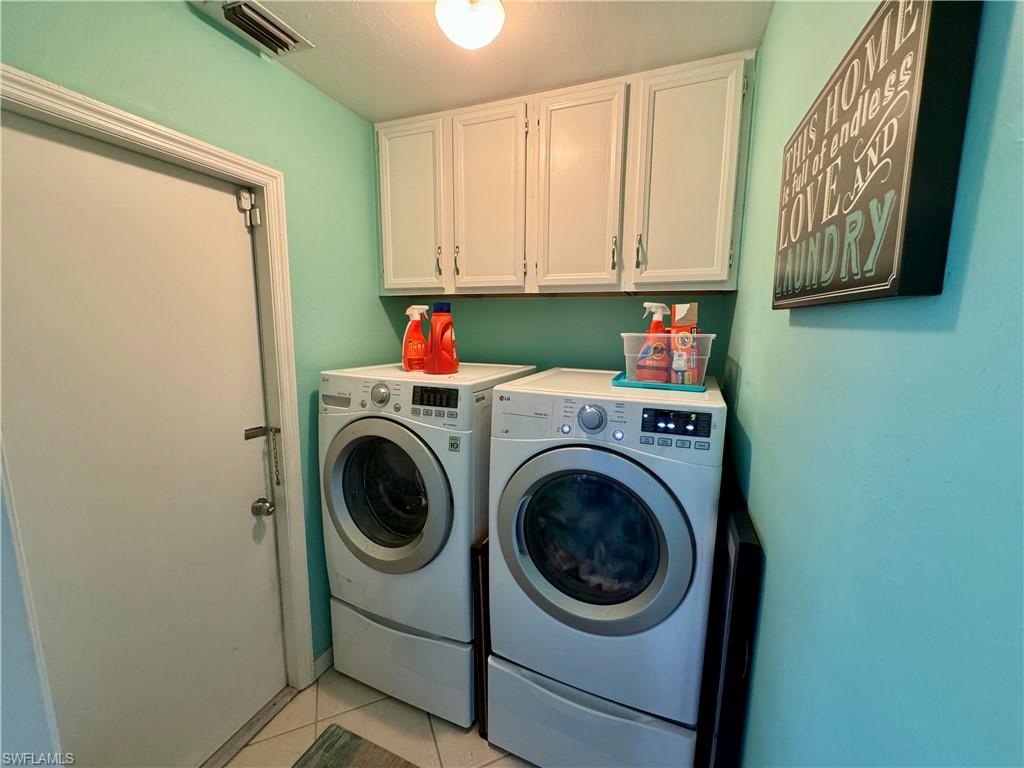 276 Madison Drive Naples, FL 34110 - Photo 15 of 22 a utility room with dryer and washer