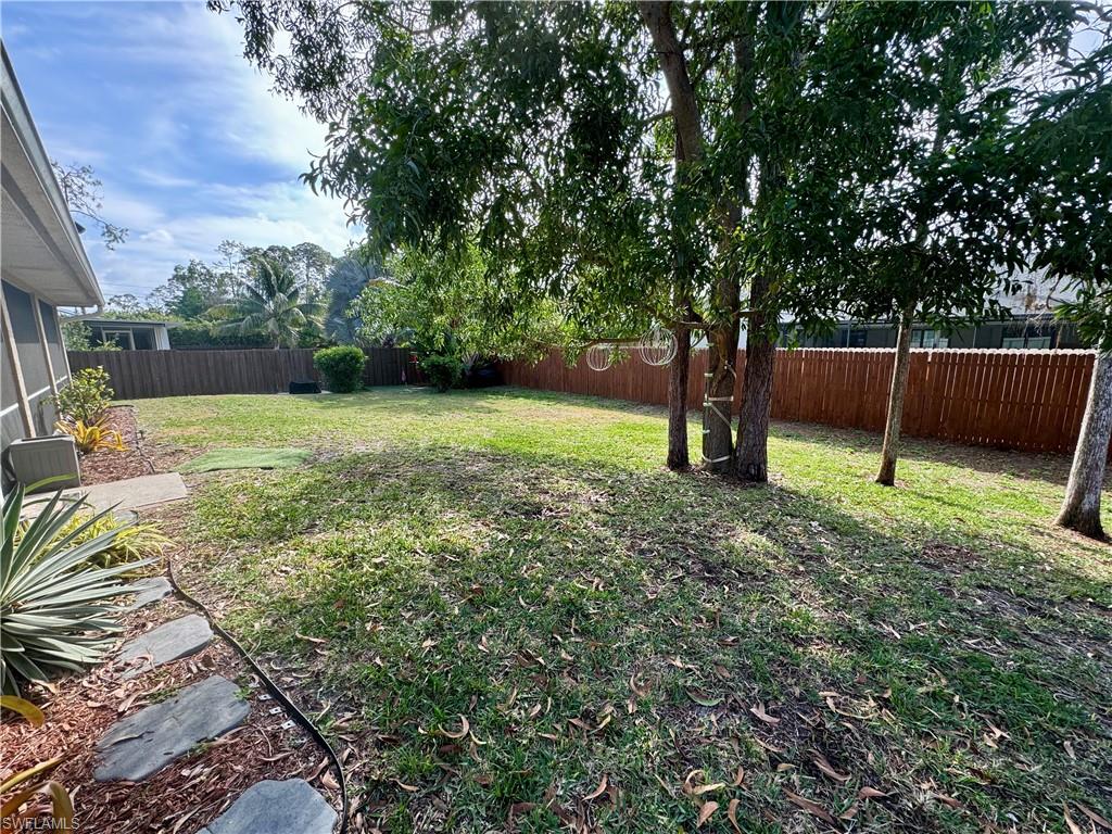 276 Madison Drive Naples, FL 34110 - Photo 18 of 22 a backyard of a house