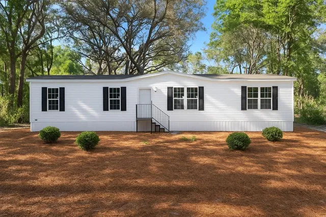 a backyard of a house with seating space