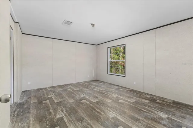 a view of an empty room with a window