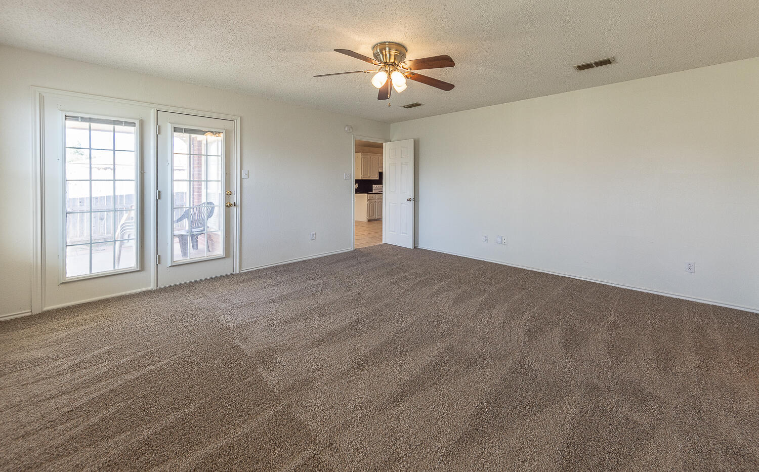 6109 13th Street Lubbock, TX 79416 - Photo 11 of 24 a view of an empty room with a window