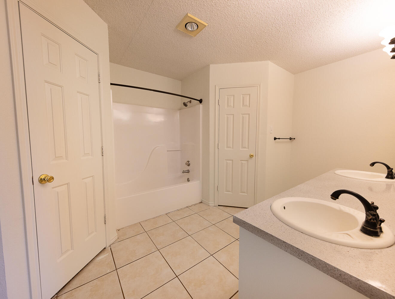 6109 13th Street Lubbock, TX 79416 - Photo 12 of 24 a bathroom with a sink and a shower