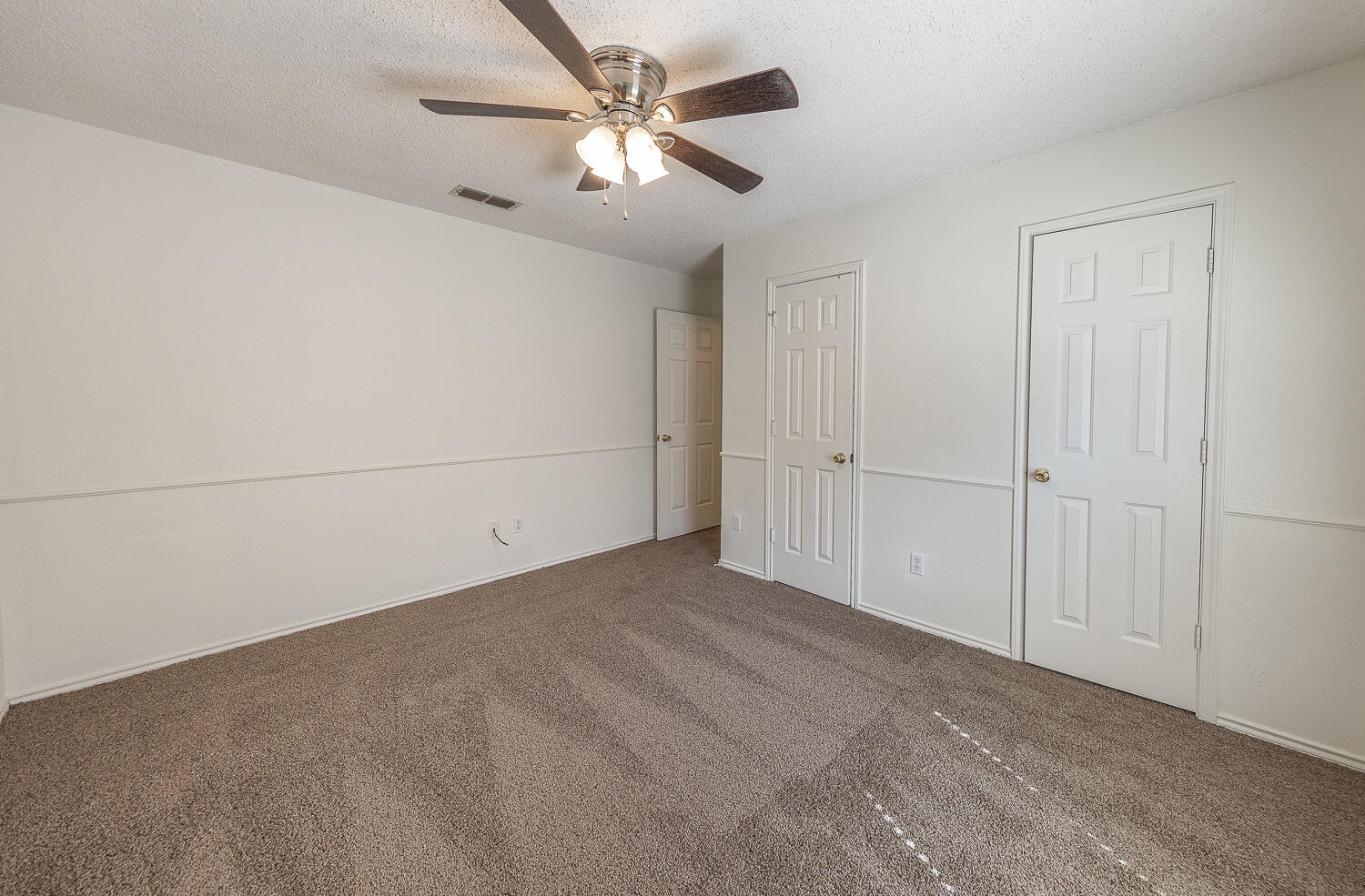 6109 13th Street Lubbock, TX 79416 - Photo 18 of 24 an empty room with chandelier fan