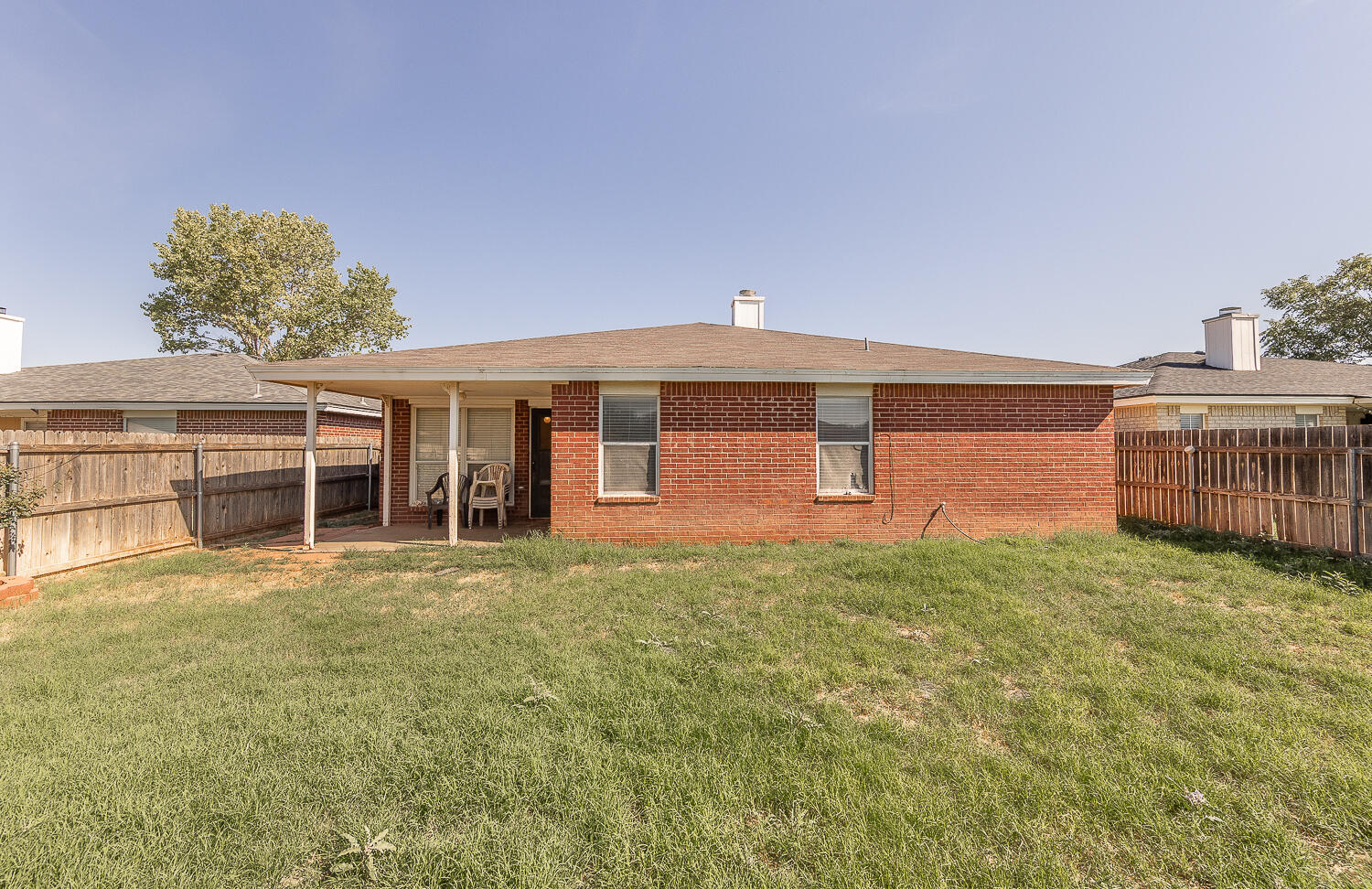 6109 13th Street Lubbock, TX 79416 - Photo 22 of 24 a front view of a house with a yard