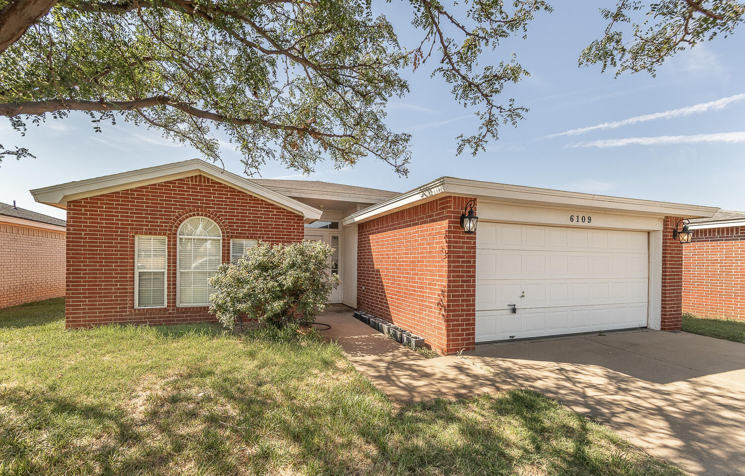 6109 13th Street Lubbock, TX 79416 - Photo 24 of 24 a view of a house with a yard and garage