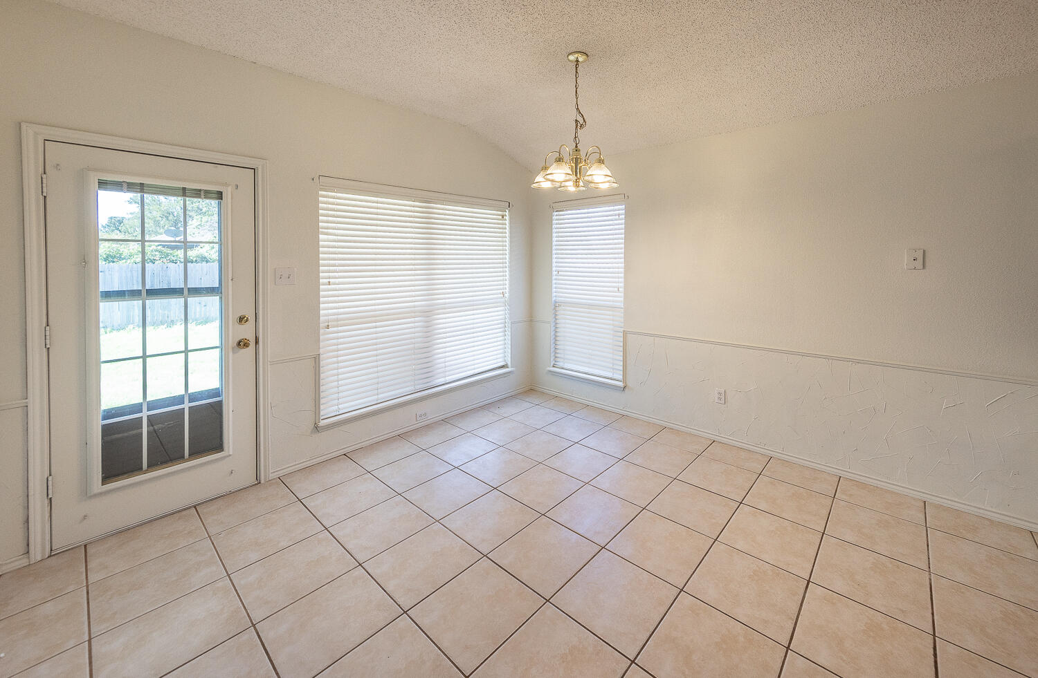 6109 13th Street Lubbock, TX 79416 - Photo 6 of 24 a view of empty room with windows