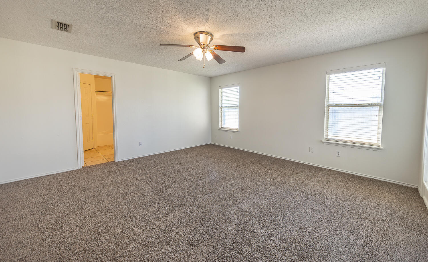 6109 13th Street Lubbock, TX 79416 - Photo 10 of 24 a view of an empty room with a window