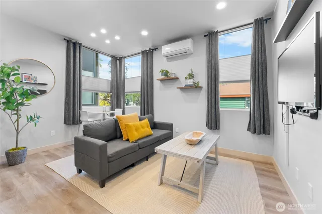 a living room with furniture and a large window