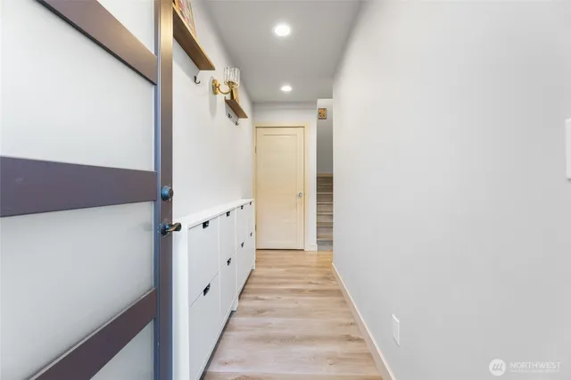 a view of a hallway with white walls