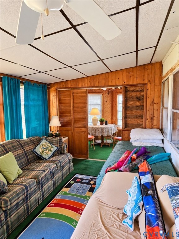 36 Beach Road Reedville, VA 22539 - Photo 35 of 35 Wood-paneled room featuring a ceiling fan, wall sc