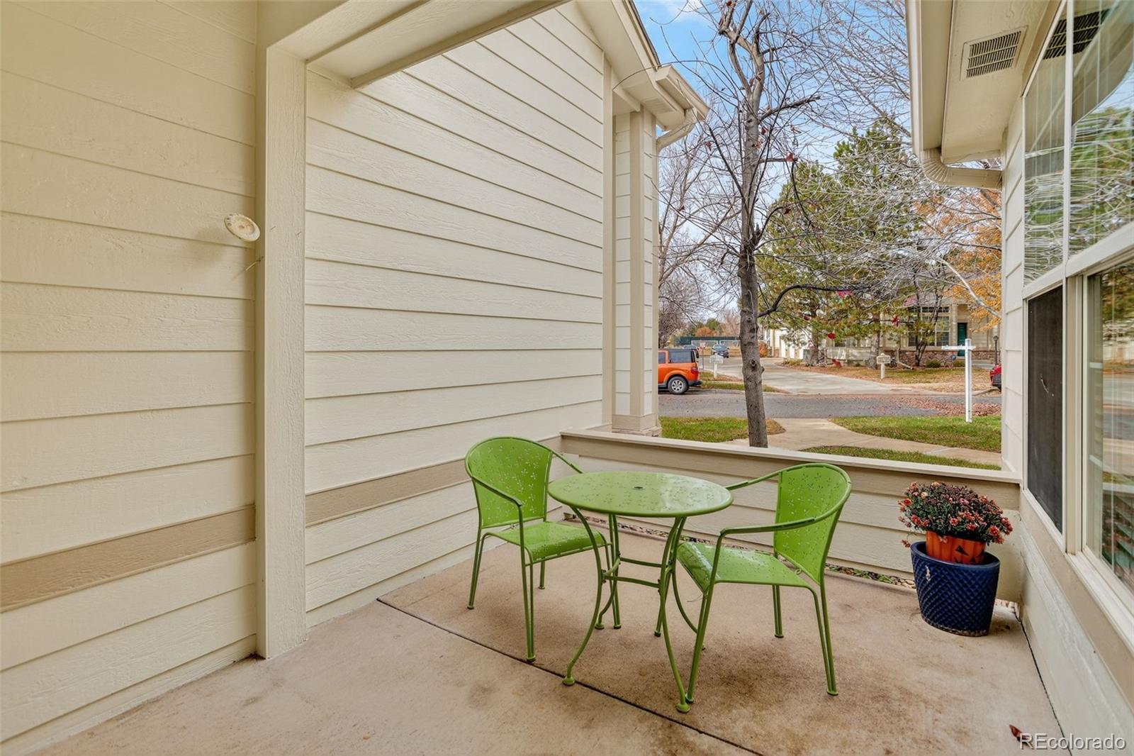 203 Remuda Lane, Unit 203 Lafayette, CO 80026 - Photo 17 of 35 a backyard of a house with table and chairs
