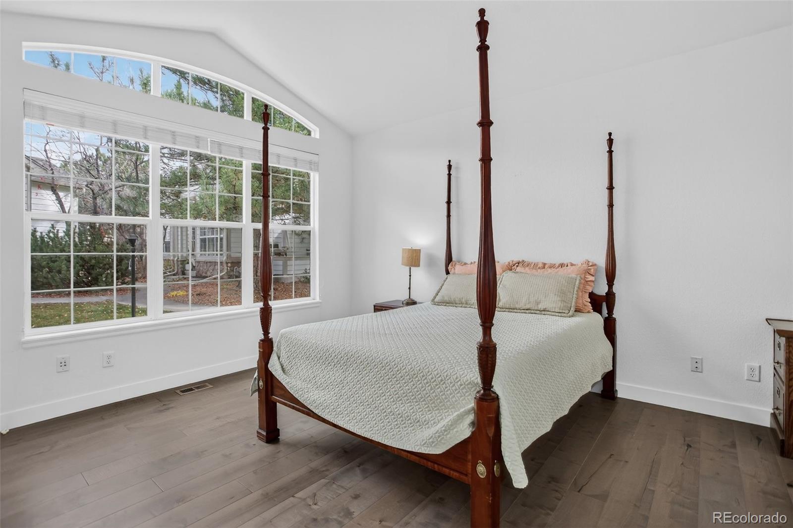 203 Remuda Lane, Unit 203 Lafayette, CO 80026 - Photo 19 of 35 a bed sitting in a bedroom next to a window