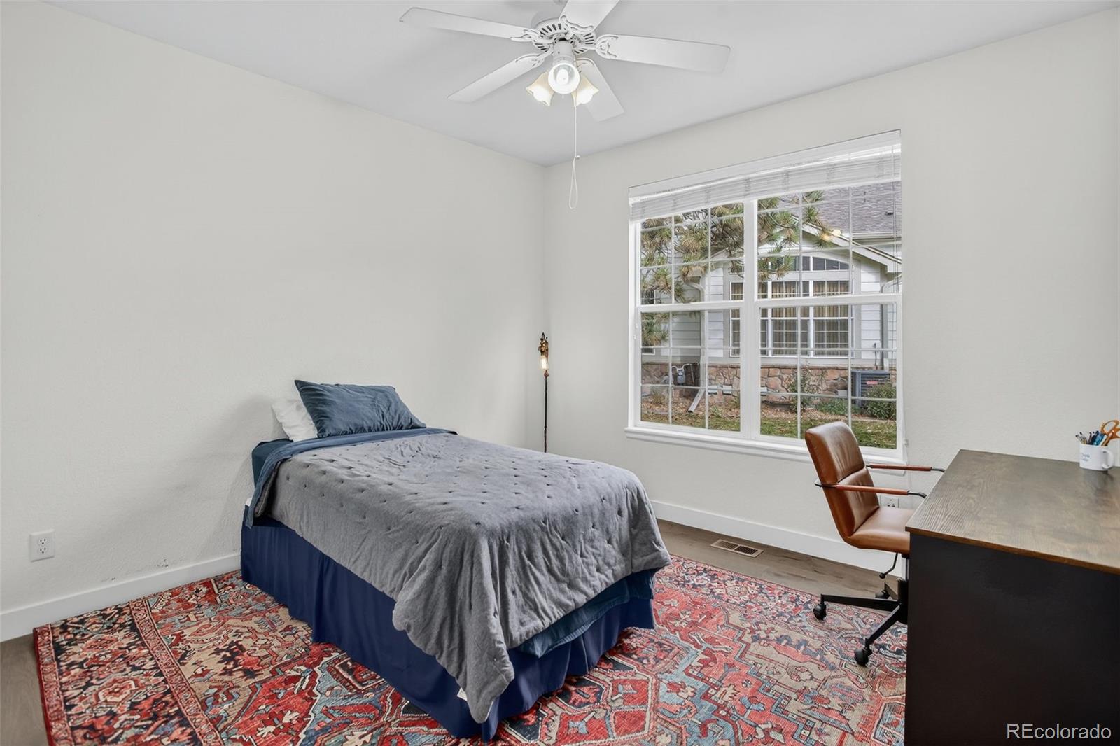 203 Remuda Lane, Unit 203 Lafayette, CO 80026 - Photo 25 of 35 a bedroom with a bed and a window