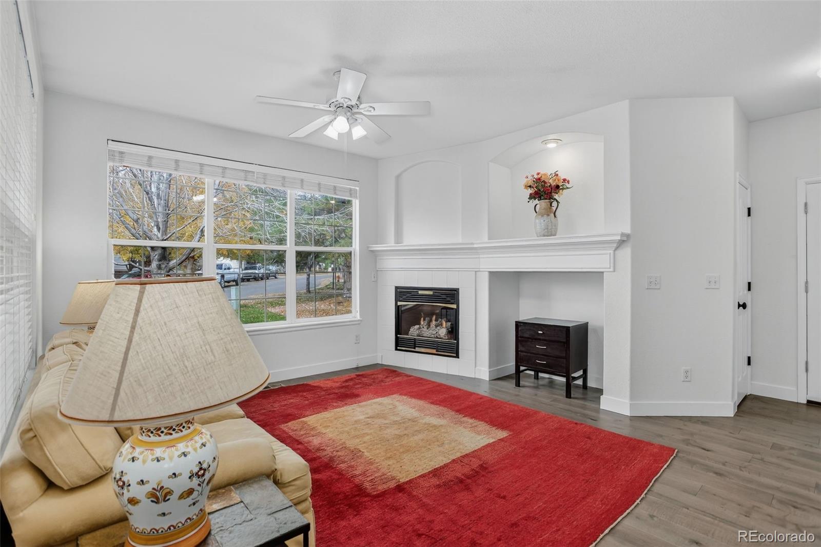 203 Remuda Lane, Unit 203 Lafayette, CO 80026 - Photo 3 of 35 a living room with furniture and a fireplace