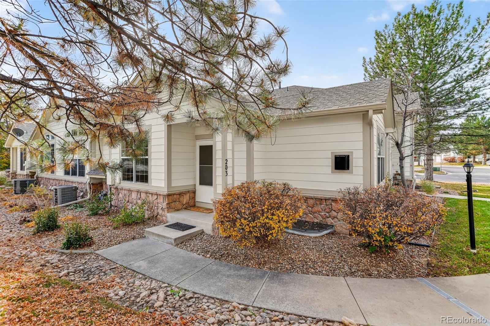 203 Remuda Lane, Unit 203 Lafayette, CO 80026 - Photo 31 of 35 a front view of a house with garden