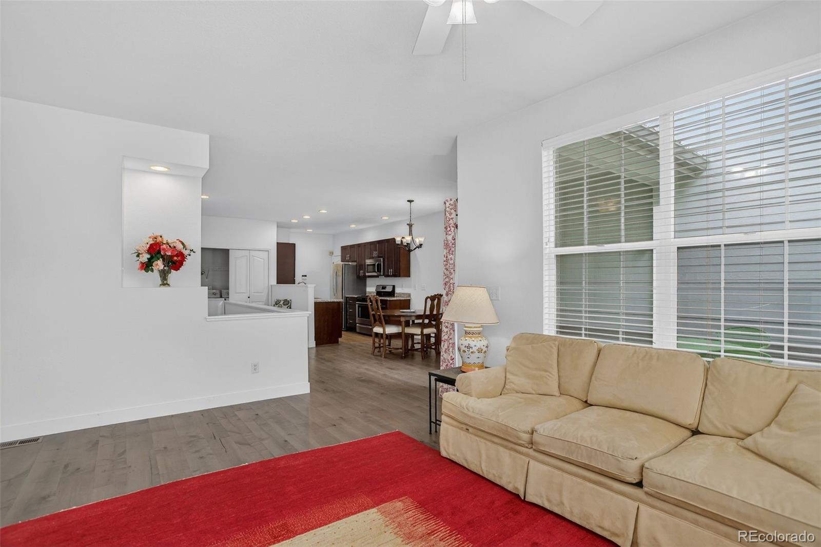 203 Remuda Lane, Unit 203 Lafayette, CO 80026 - Photo 5 of 35 a living room with furniture and a large window