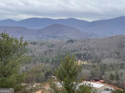a view of a town with mountains in the background
