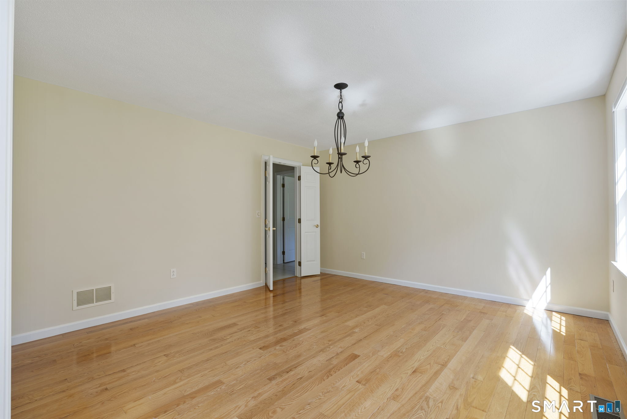 555 Waterville Road Avon, CT 06001 - Photo 14 of 40 a view of a room with wooden floor and ceiling fan