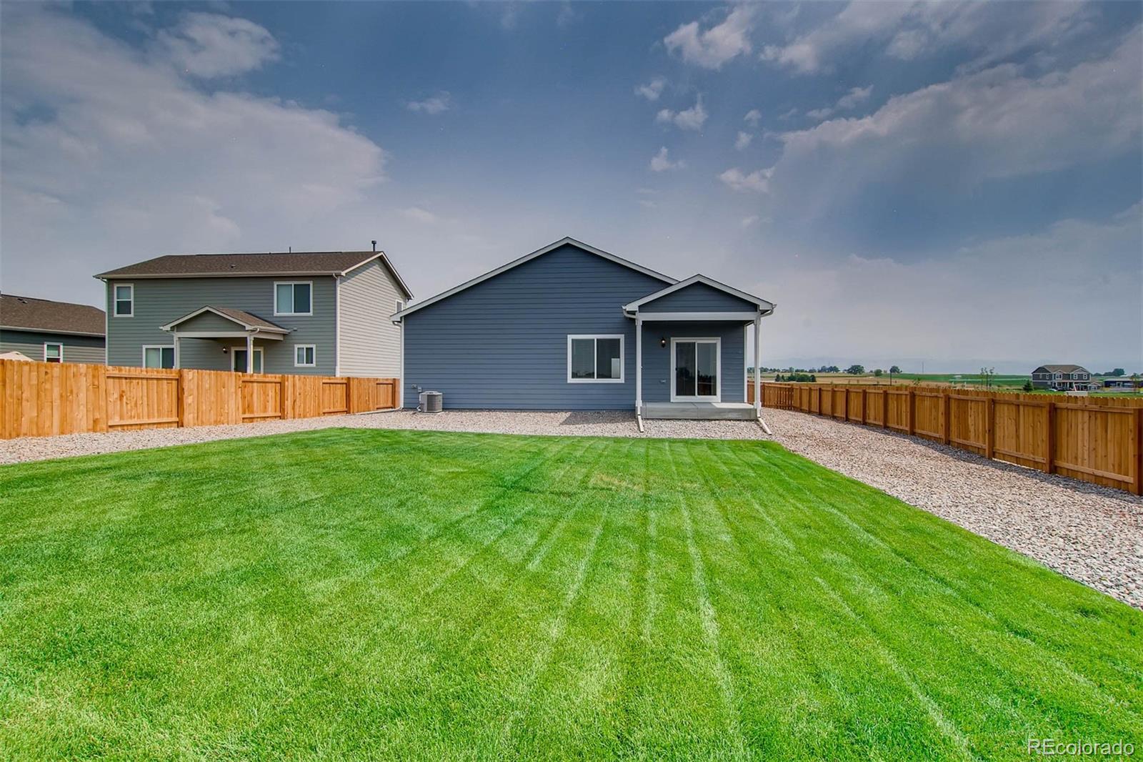 2299 Murray Street Mead, CO 80504 - Photo 11 of 17 a front view of a house with yard and green space