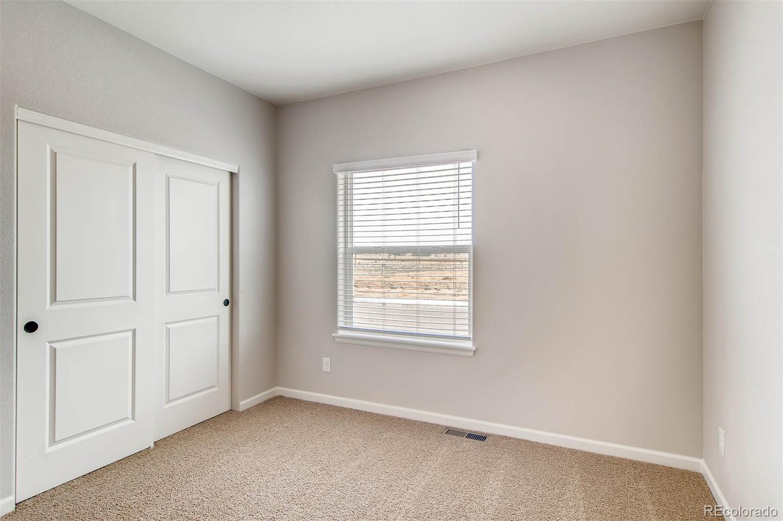 2299 Murray Street Mead, CO 80504 - Photo 6 of 17 an empty room with windows