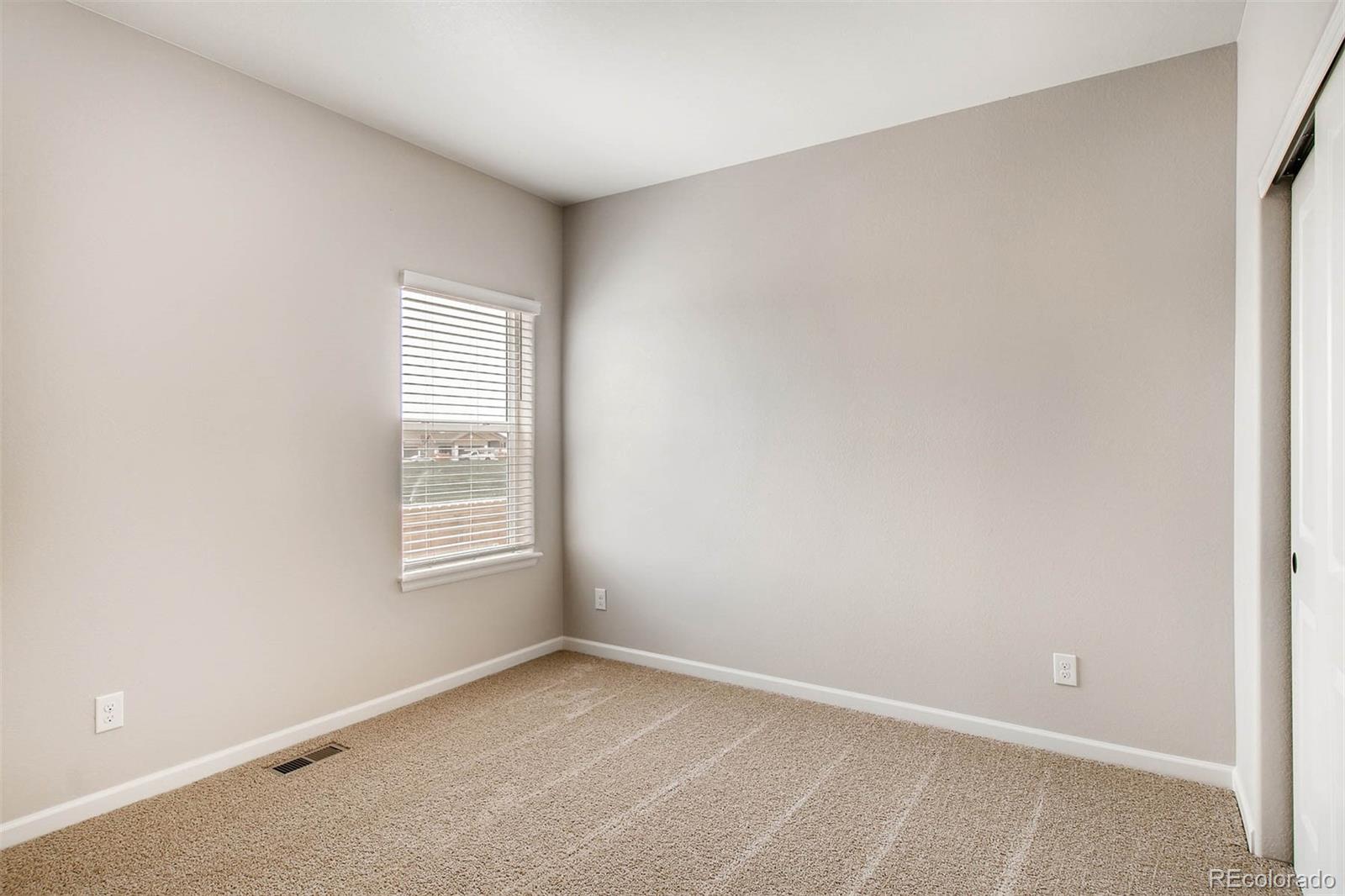 2299 Murray Street Mead, CO 80504 - Photo 7 of 17 an empty room with windows
