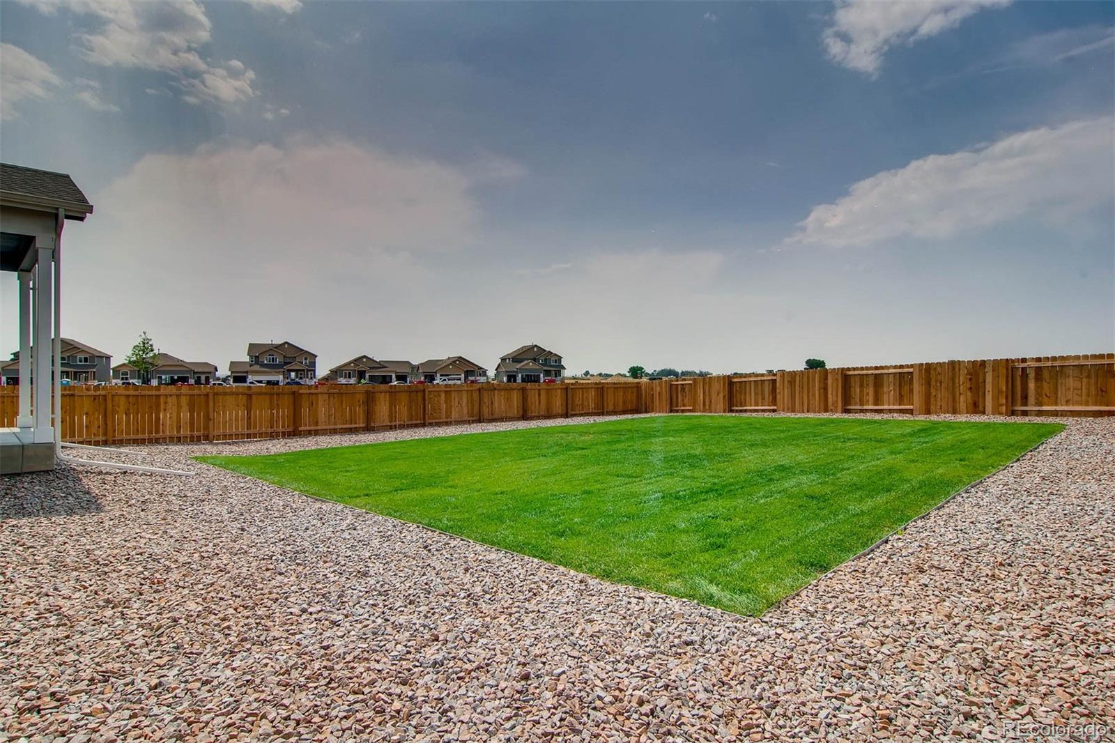 2299 Murray Street Mead, CO 80504 - Photo 9 of 17 a view of building with outdoor space and seating