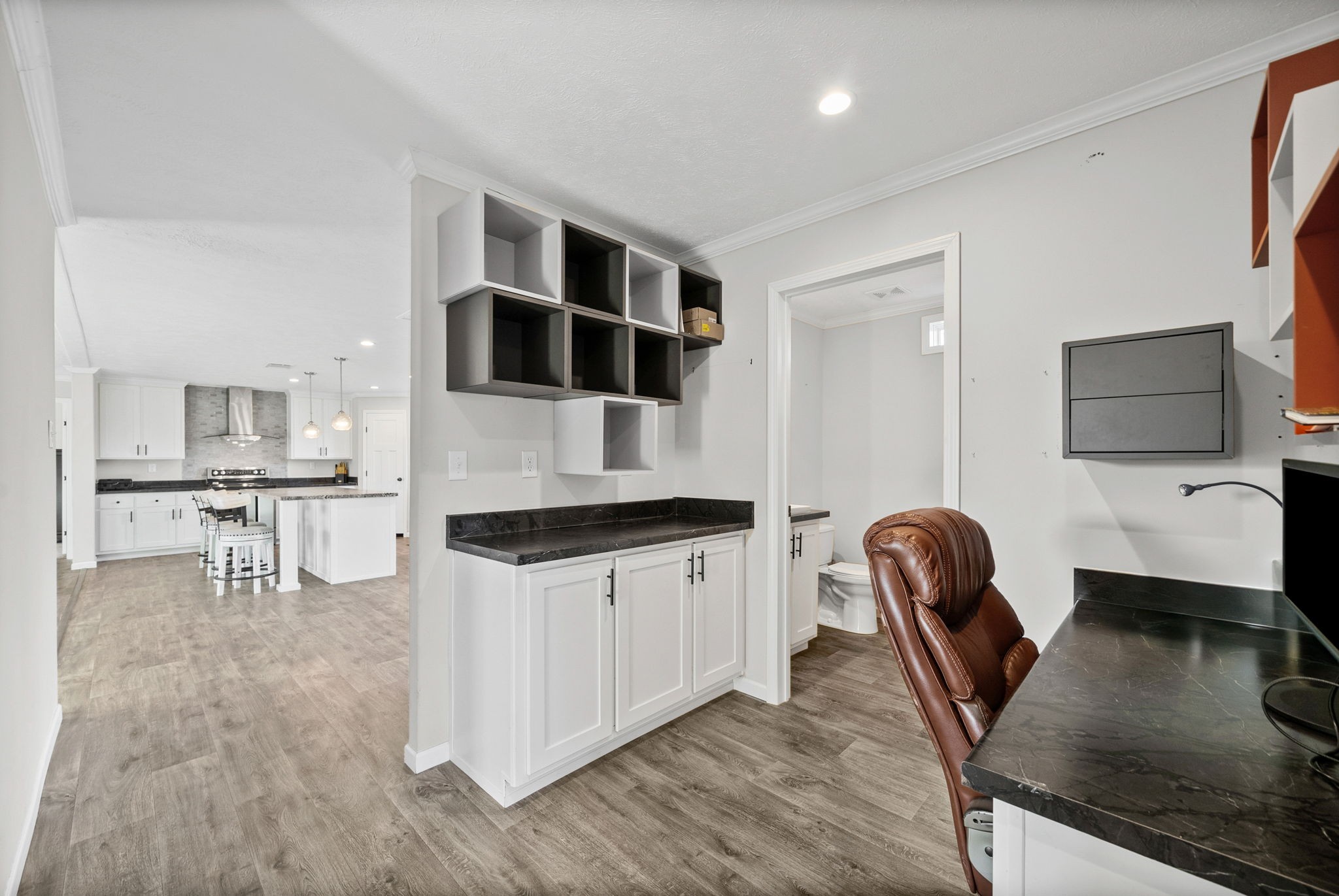 111 Antioch Road Charlotte, TN 37036 - Photo 15 of 39 a kitchen with stainless steel appliances kitchen island granite countertop a microwave a stove and white cabinets