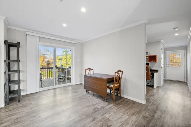 an empty room with furniture and windows