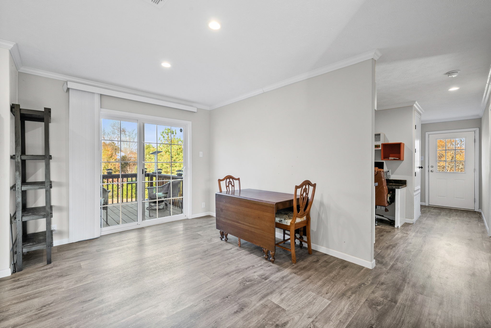 111 Antioch Road Charlotte, TN 37036 - Photo 16 of 39 an empty room with furniture and windows