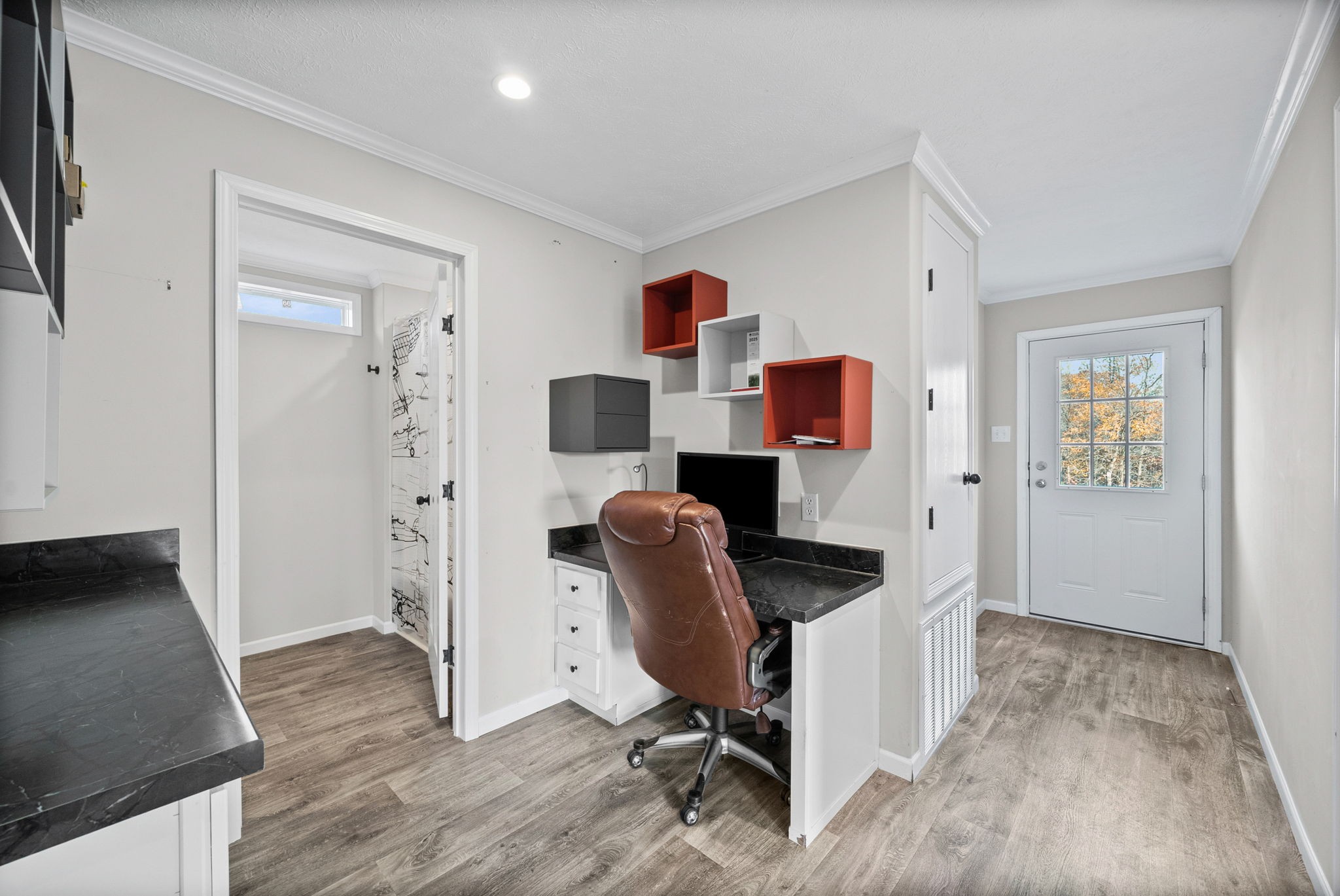 111 Antioch Road Charlotte, TN 37036 - Photo 17 of 39 a workspace with furniture and wooden floor