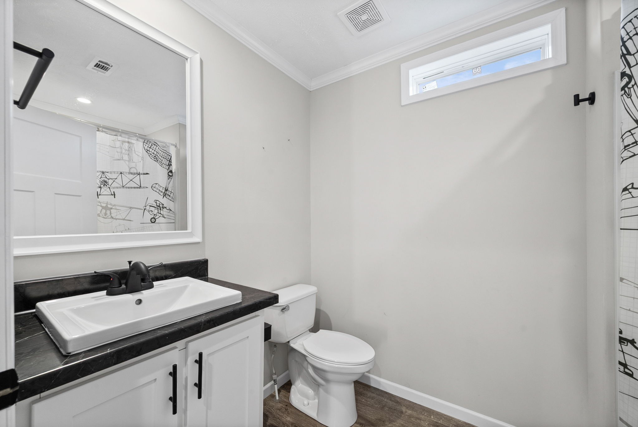 111 Antioch Road Charlotte, TN 37036 - Photo 24 of 39 a bathroom with a sink toilet and a mirror