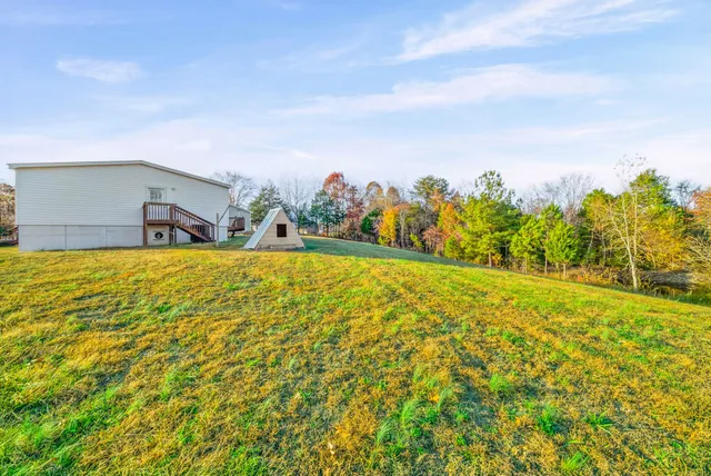 a swimming pool with an outdoor space and seating area