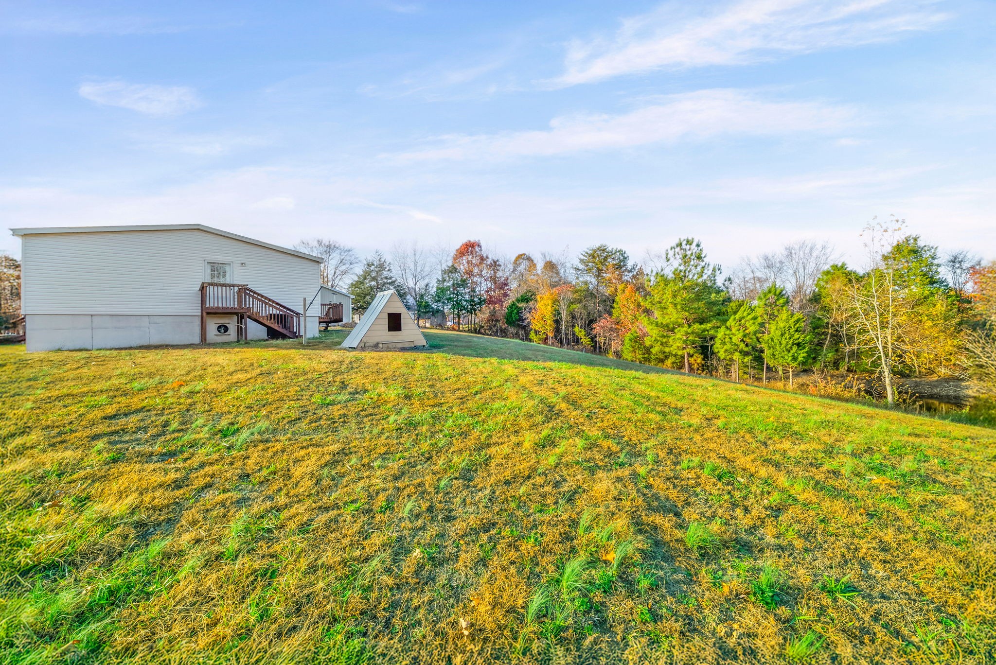 111 Antioch Road Charlotte, TN 37036 - Photo 31 of 39 a swimming pool with an outdoor space and seating area