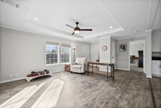 a living room with furniture and a table