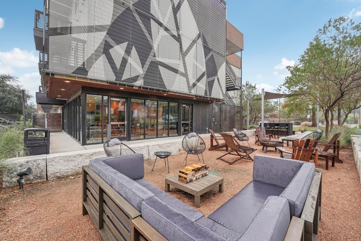2505 Thornton Road, Unit 2307 Austin, TX 78704 - Photo 24 of 36 a view of a patio with couches and a table and chairs
