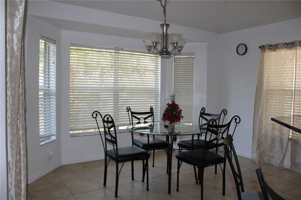 13475 Teaberry Lane Spring Hill, FL 34609 - Photo 12 of 21 a view of a dining room with furniture window and outside view