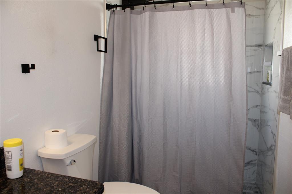 13475 Teaberry Lane Spring Hill, FL 34609 - Photo 16 of 21 a bathroom with a sink and a toilet