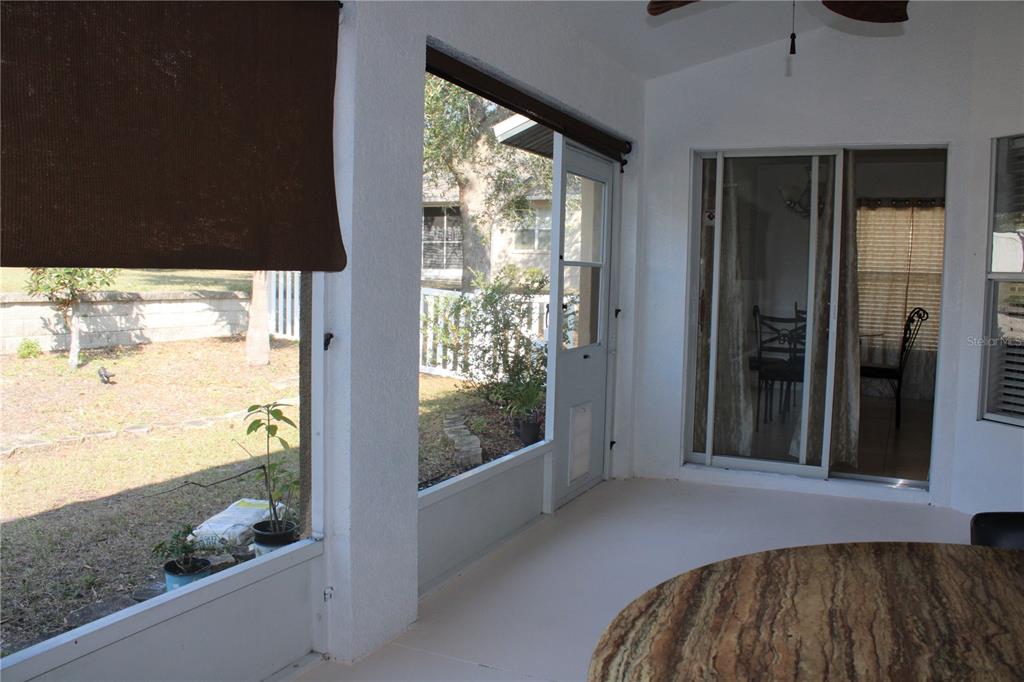 13475 Teaberry Lane Spring Hill, FL 34609 - Photo 19 of 21 a view of a living room and floor to ceiling window