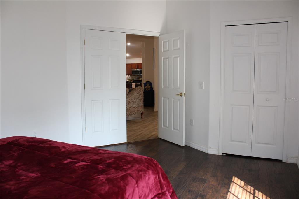 13475 Teaberry Lane Spring Hill, FL 34609 - Photo 6 of 21 a bedroom with a bed and closet