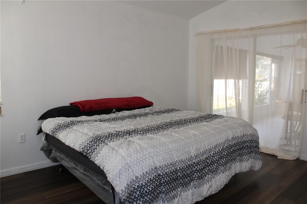 13475 Teaberry Lane Spring Hill, FL 34609 - Photo 8 of 21 a bedroom with a bed and window