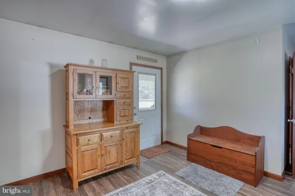 a living room with furniture ceiling fan and a rug