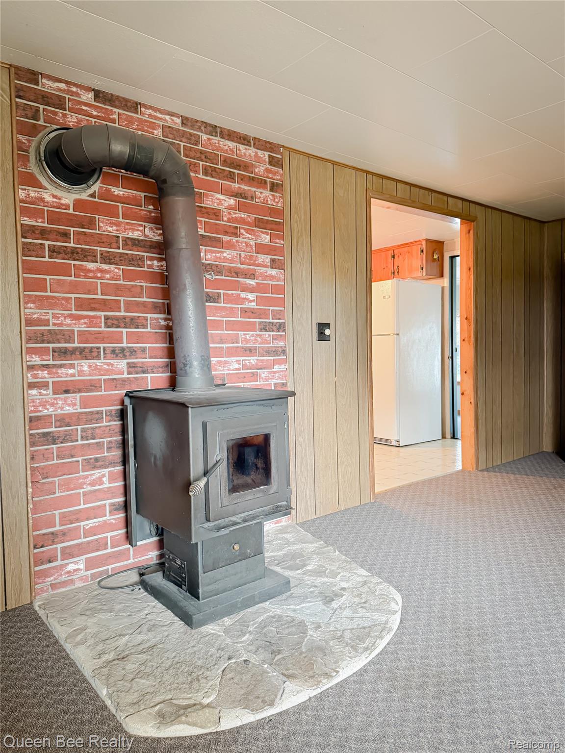 9012 Lincoln Road Harbor Beach, MI 48441 - Photo 6 of 15 Wood burning stove in living room